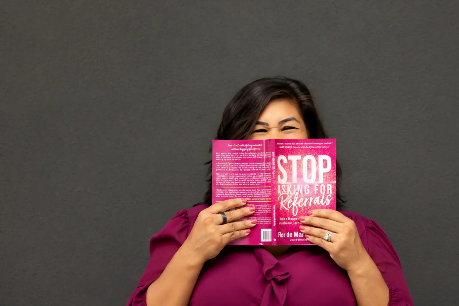 Flor peeking over the top of her book
